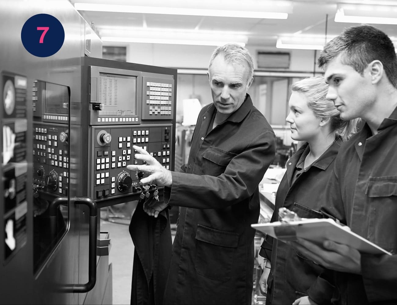 An older man instructs two younger colleagues on how to use some electrical equipment in an workplace #Clue: you discovered the letter O! Now go to image 4